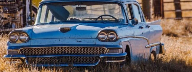 Classic american car in a country field.