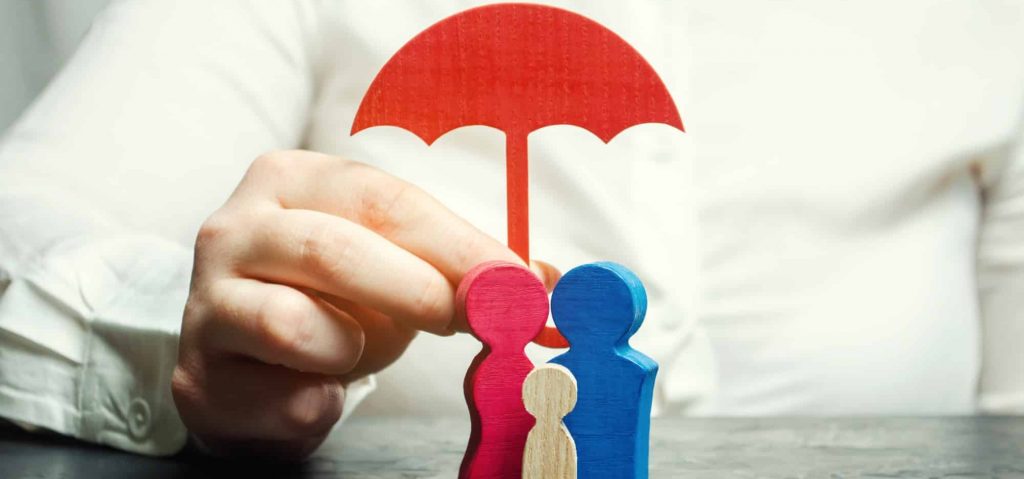 Top rated life insurance companies picture of insurance agent holding umbrella over a family